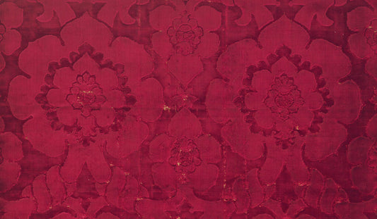 Velvet with the pattern delineated solely by the contrast between two heights of the dense silk velvet pile was particularly popular in the sixteenth century. This pattern of lobed palmettes, sometimes incorporating crowns, was made into robes or sashes w