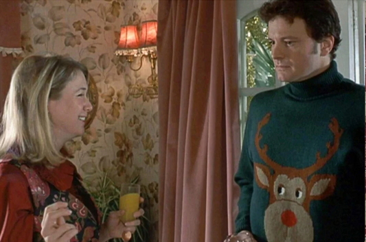 Mr Darcy wearing a green reindeer Christmas jumper. 